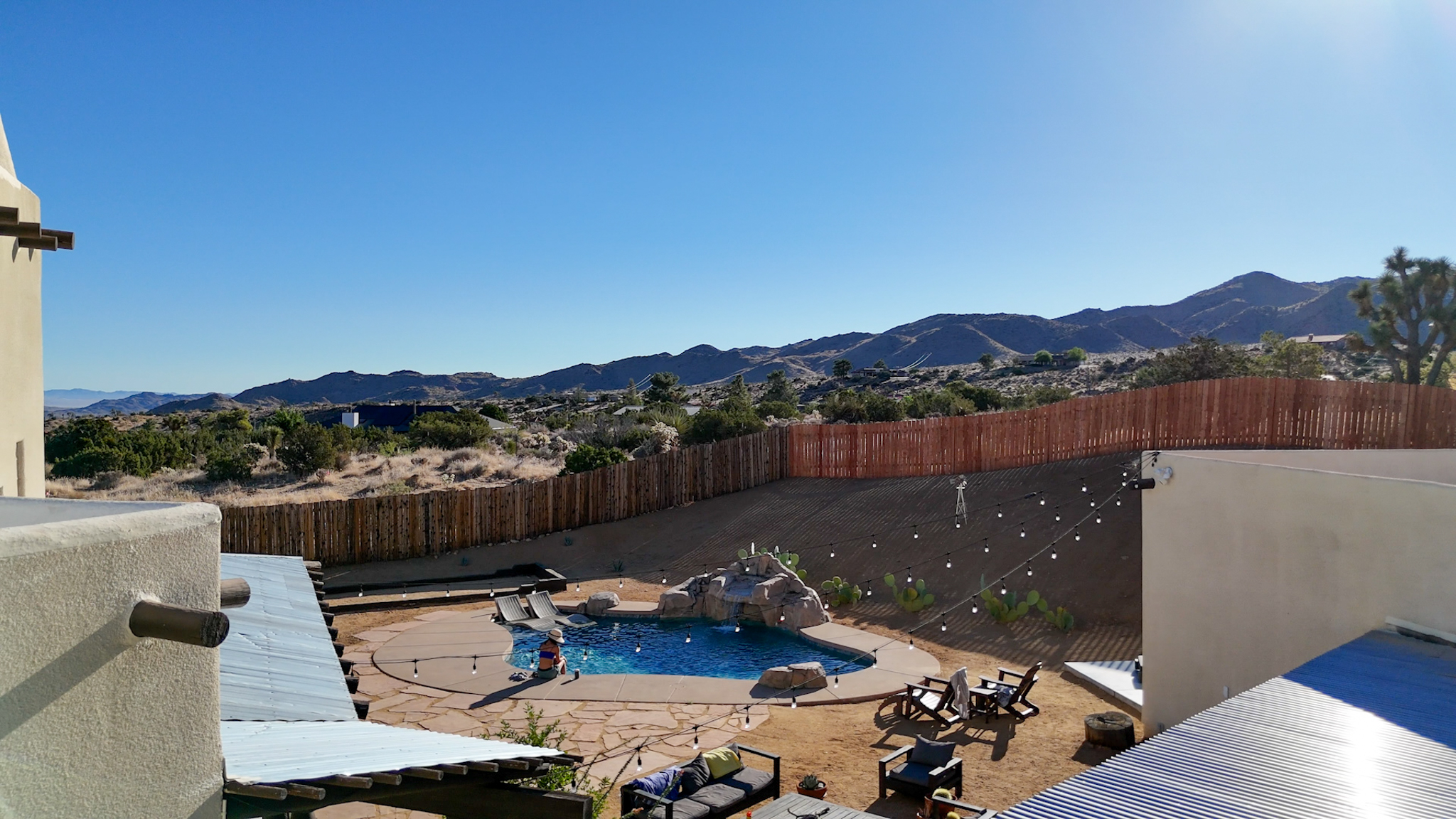 Backyard pergola with lounge seating
