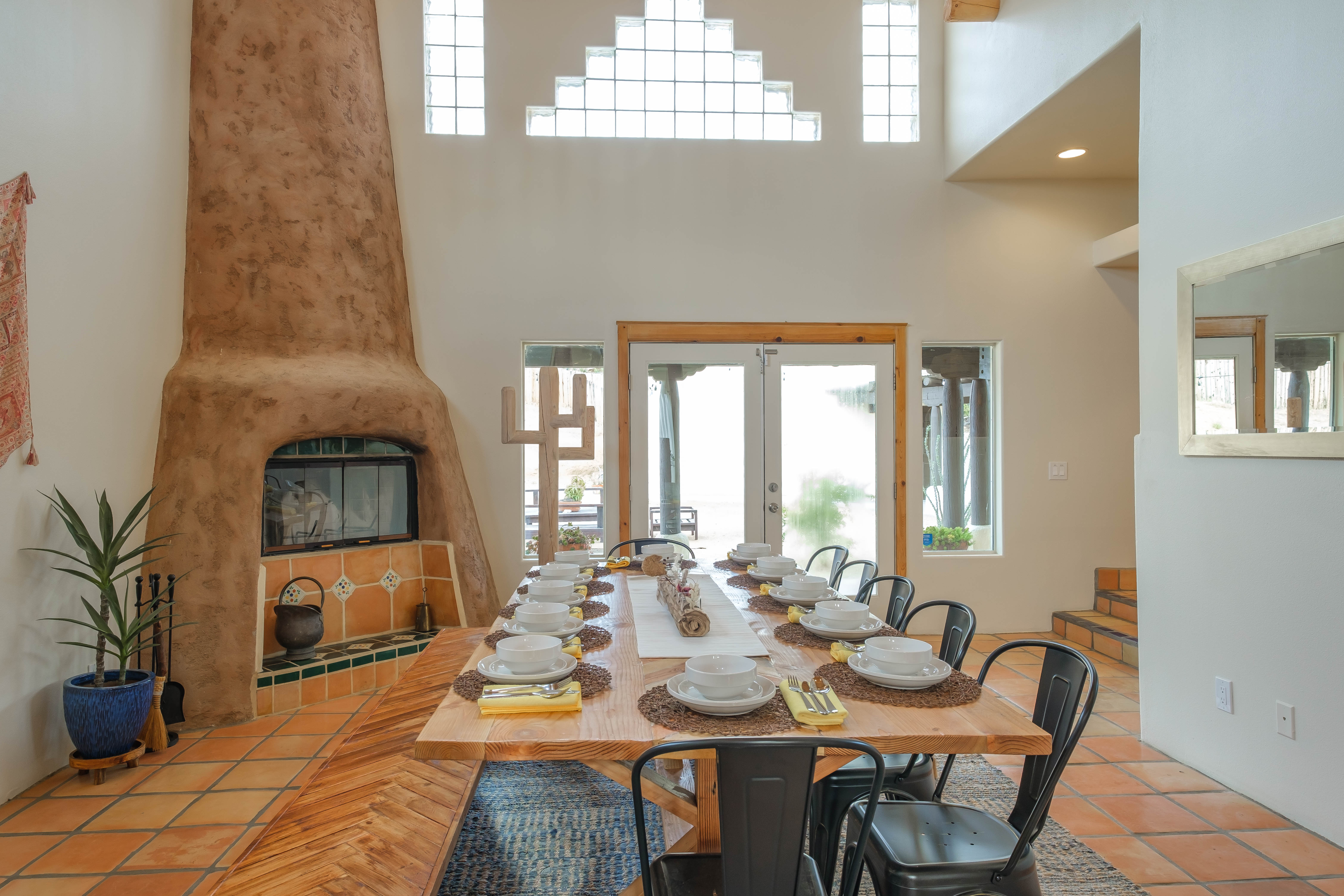 Spacious dining room with adobe fireplace